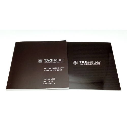 69 - A Tag Heuer Monaco Automatic Gents Watch. Model WW2110-0. Black leather strap. Stainless steel case ... 