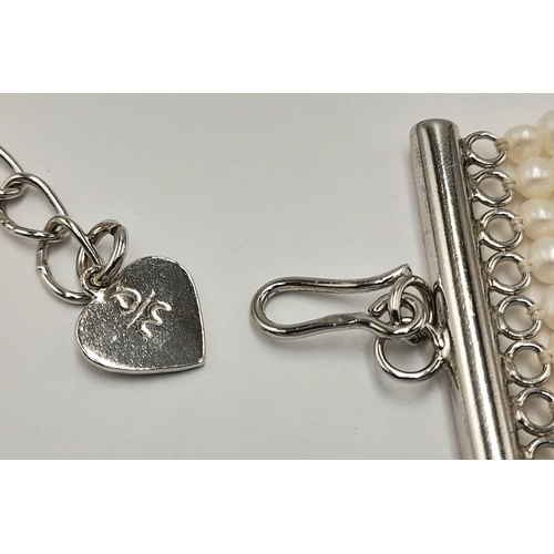 112 - Impressive 10 STRAND, PEARL and SILVER CHOKER NECKLACE. Consisting 10 rows of lab seed pearls with S... 