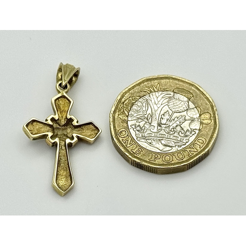 163 - A 14K Yellow Gold, Diamond and Garnet Cross Pendant. 3cm. 2.9g. Ref: 13/61405