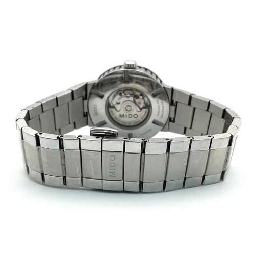 181 - A Mido Automatic Ladies Watch. Model M015230A. Stainless steel bracelet and case - 32mm. Black textu... 