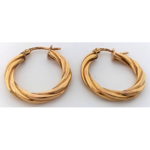 177 - A PAIR OF 9K GOLD CREOLE HOOP EARRINGS.   1.3gms