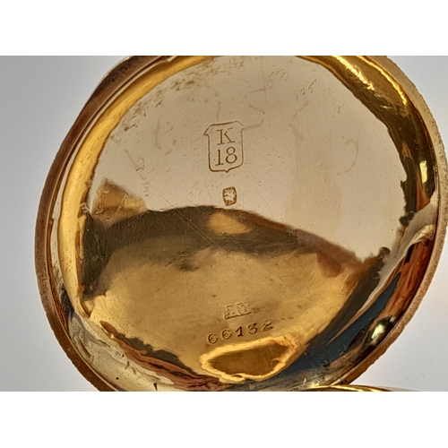 81 - AN EARLY 20TH CENTURY 18K GOLD FRENCH LADIES POCKET WATCH WITH HAND CHASED CASE AND ORNATE FLORAL DE... 