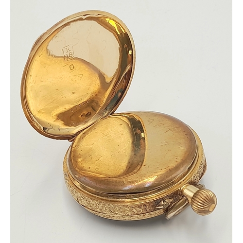 81 - AN EARLY 20TH CENTURY 18K GOLD FRENCH LADIES POCKET WATCH WITH HAND CHASED CASE AND ORNATE FLORAL DE... 