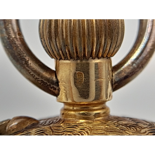 81 - AN EARLY 20TH CENTURY 18K GOLD FRENCH LADIES POCKET WATCH WITH HAND CHASED CASE AND ORNATE FLORAL DE... 