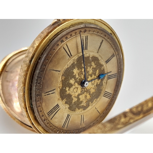 81 - AN EARLY 20TH CENTURY 18K GOLD FRENCH LADIES POCKET WATCH WITH HAND CHASED CASE AND ORNATE FLORAL DE... 