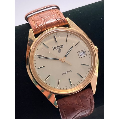 84 - Gentleman’s PULSAR QUARTZ WRISTWATCH. Finished  in GOLD TONE Stainless Steel. Brown leather strap. E... 