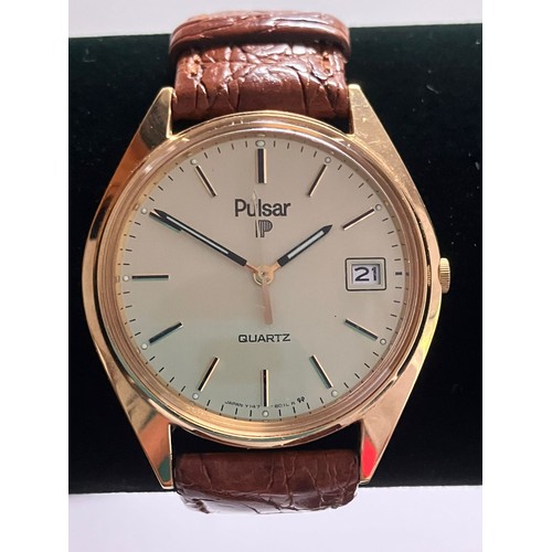 84 - Gentleman’s PULSAR QUARTZ WRISTWATCH. Finished  in GOLD TONE Stainless Steel. Brown leather strap. E... 