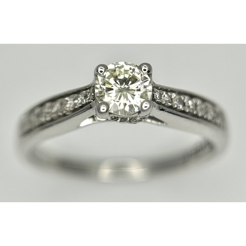 83 - An 18k white gold diamond solitaire with diamond shoulders ring, 0.50ct diamond weight, 2.9g total w... 