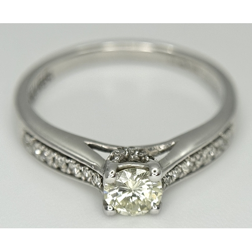 83 - An 18k white gold diamond solitaire with diamond shoulders ring, 0.50ct diamond weight, 2.9g total w... 