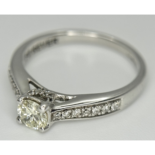83 - An 18k white gold diamond solitaire with diamond shoulders ring, 0.50ct diamond weight, 2.9g total w... 