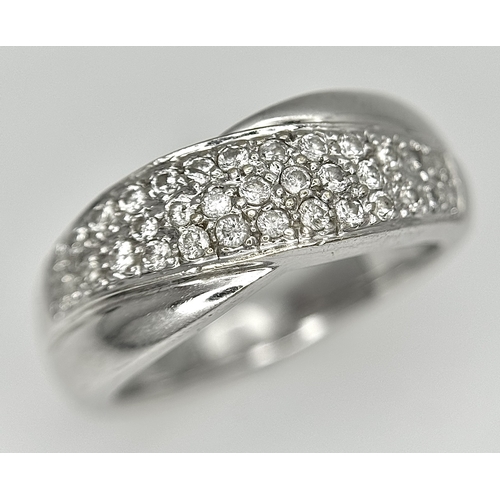 90 - An 18k white gold diamond twist ring, 0.40ct diamond weight, 6.4g total weight, ring size N. SH463I