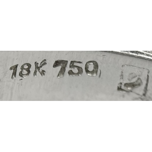 90 - An 18k white gold diamond twist ring, 0.40ct diamond weight, 6.4g total weight, ring size N. SH463I