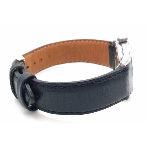 61 - A Gents Rolex Marconi special watch. In working order, rare black dial.  Hallmarked inner case RWC (... 