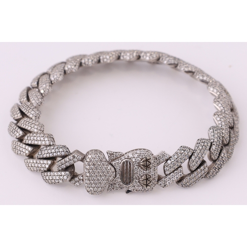 115 - A HEAD TURNING 9K WHITE GOLD,FANCY LINK DIAMOND CLUSTER BRACELET. 7.50CTW OF DIAMONDS, H-I COLOUR, S... 