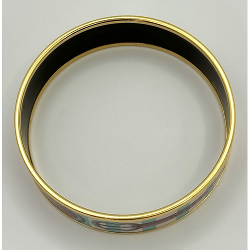 780 - An Hermes Colourful Decorative Enamel and Gilded Metal Bangle. 20mm width. 62mm inner diameter.  Ref... 