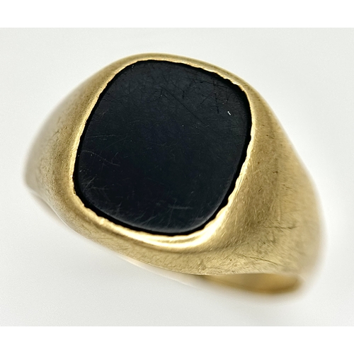 148 - A Vintage 9K Yellow Gold Black Onyx Signet Ring. Size V. 3.4g.