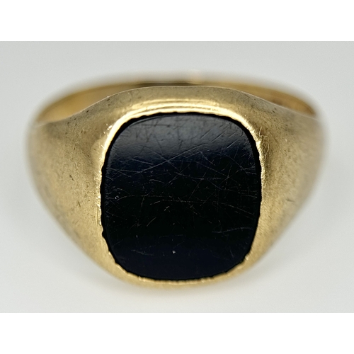 148 - A Vintage 9K Yellow Gold Black Onyx Signet Ring. Size V. 3.4g.