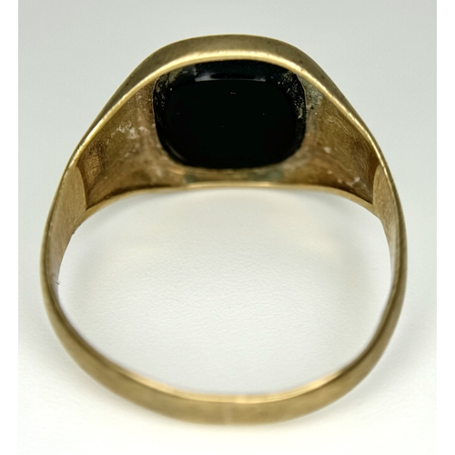 148 - A Vintage 9K Yellow Gold Black Onyx Signet Ring. Size V. 3.4g.