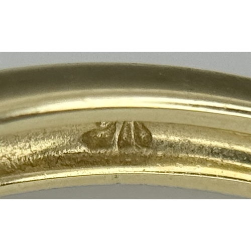 575 - A 9K Yellow Gold Ring in Bow-Tie Form. Size P 1/2. 2.85g.