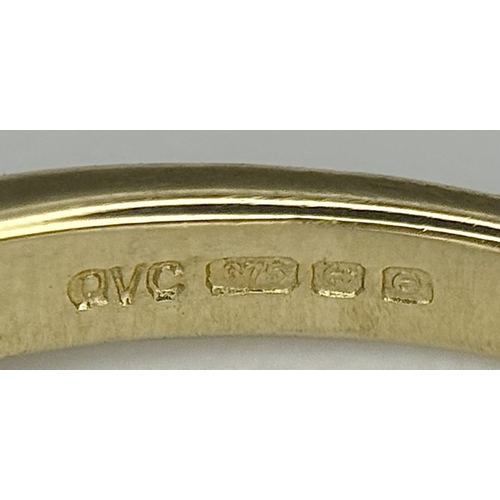 575 - A 9K Yellow Gold Ring in Bow-Tie Form. Size P 1/2. 2.85g.