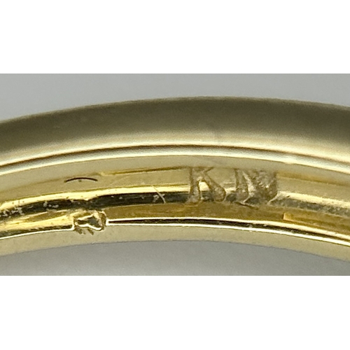 575 - A 9K Yellow Gold Ring in Bow-Tie Form. Size P 1/2. 2.85g.