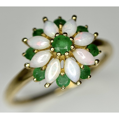 578 - A 9K Yellow Gold Opal and Emerald Ring in Floral Form. Size R. 2.1g.