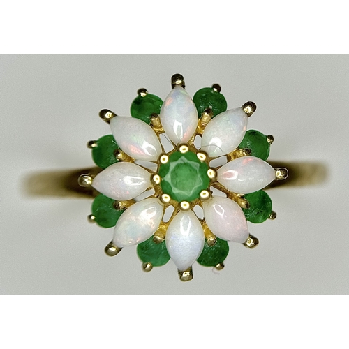 578 - A 9K Yellow Gold Opal and Emerald Ring in Floral Form. Size R. 2.1g.