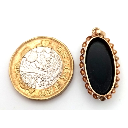 239 - A 9K Yellow Gold Opal Doublet Pendant. Nice colour play. 3cm. 2.1g.