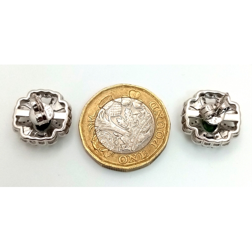 543 - A Pair of Green Sapphire Stud Earrings. Diamond accents. Set in 925 Silver. Comes with a case. CD-19... 