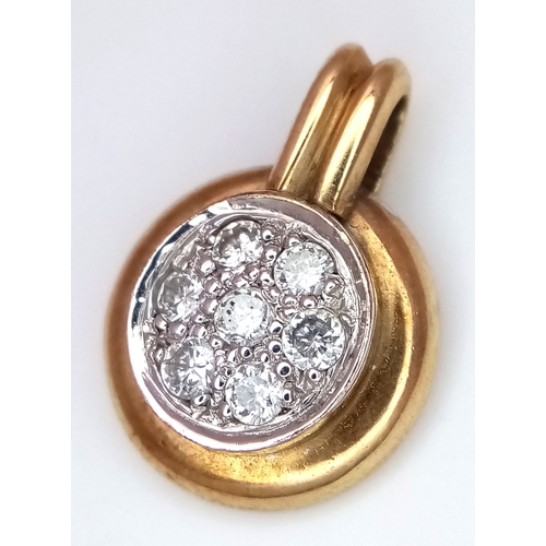 550 - A 9K Yellow Gold and Diamond Pendant. 1.5cm. 2.77g.