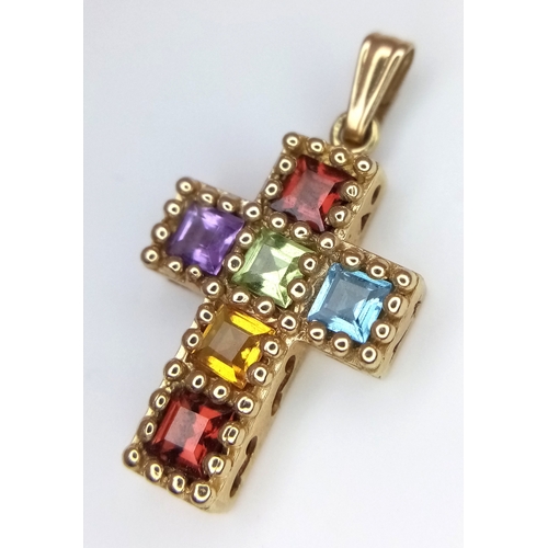 577 - A 10K Yellow Gold Multi Gem-set Cross Pendant. 2.5cm. 1.5g.
