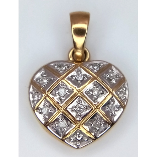 940 - A 9K Yellow Gold Diamond Heart Pendant. 2cm. 0.95g.