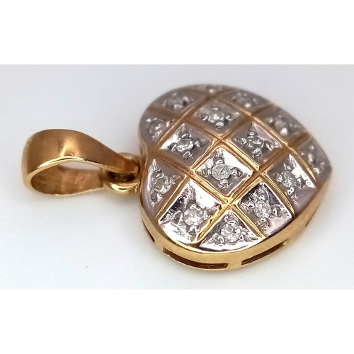 940 - A 9K Yellow Gold Diamond Heart Pendant. 2cm. 0.95g.