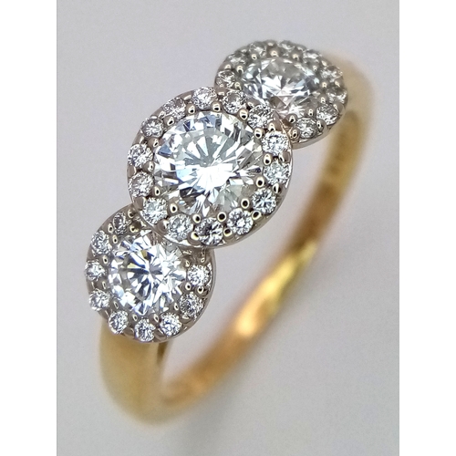 135 - A Breath-Taking 18K Yellow Gold Diamond Cluster Ring. Three round brilliant cut diamonds with diamon... 