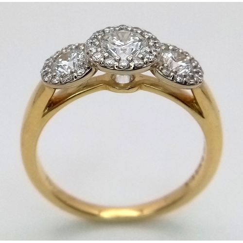 135 - A Breath-Taking 18K Yellow Gold Diamond Cluster Ring. Three round brilliant cut diamonds with diamon... 