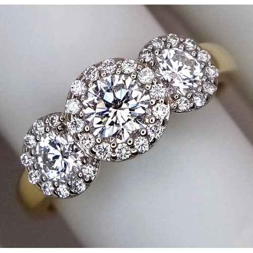 135 - A Breath-Taking 18K Yellow Gold Diamond Cluster Ring. Three round brilliant cut diamonds with diamon... 