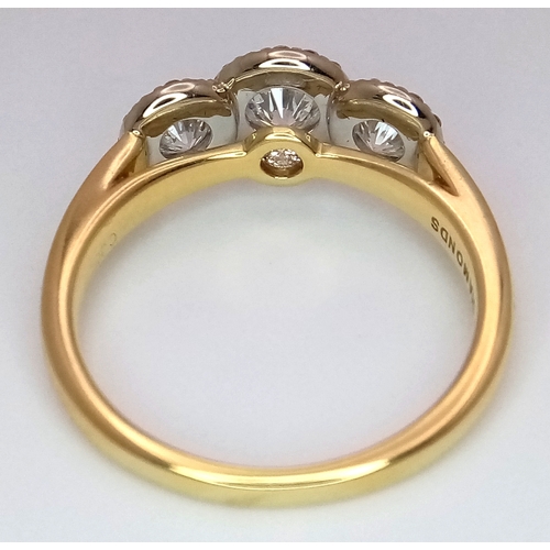 135 - A Breath-Taking 18K Yellow Gold Diamond Cluster Ring. Three round brilliant cut diamonds with diamon... 