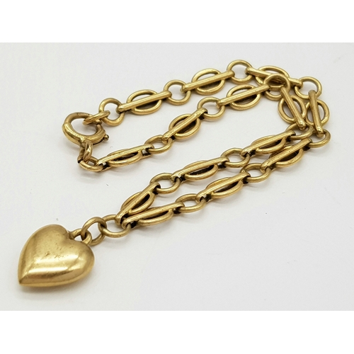 141 - A Vintage 9K Yellow Gold Link Bracelet with Heart Charm. 18cm. 4.9g.