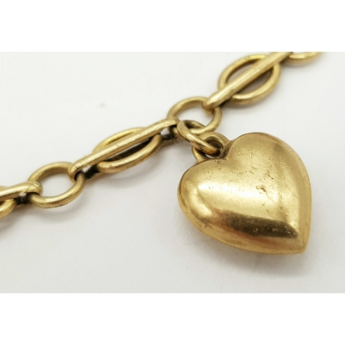 141 - A Vintage 9K Yellow Gold Link Bracelet with Heart Charm. 18cm. 4.9g.