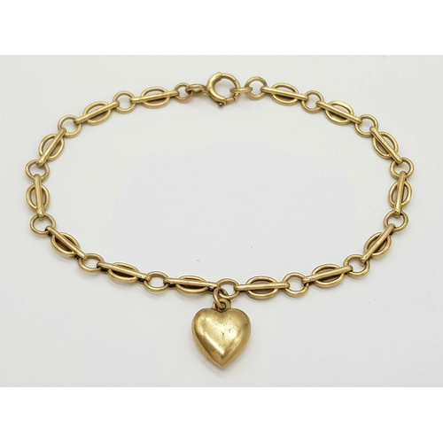 141 - A Vintage 9K Yellow Gold Link Bracelet with Heart Charm. 18cm. 4.9g.