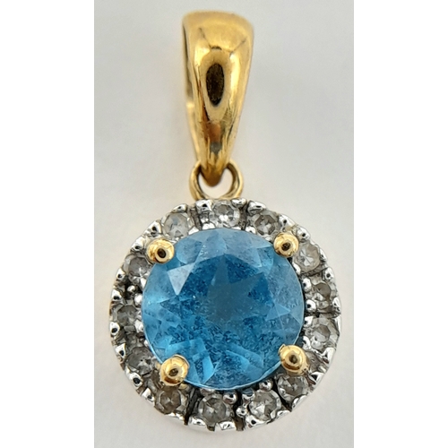 547 - A 9K Yellow Gold Aquamarine and Diamond Pendant. 17mm. 1g.