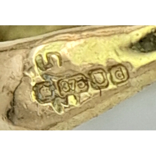 547 - A 9K Yellow Gold Aquamarine and Diamond Pendant. 17mm. 1g.