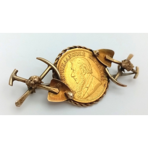 584 - An 1895 South African 1/2 Pond Gold Coin Brooch. Decorated with mining motifs. 22k gold coin. 9K set... 