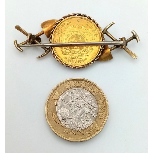 584 - An 1895 South African 1/2 Pond Gold Coin Brooch. Decorated with mining motifs. 22k gold coin. 9K set... 
