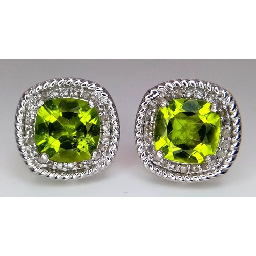 589 - A Pair of Peridot Gemstone Stud Earrings with Diamond Accents. Set in 925 Silver. Comes with a case.... 