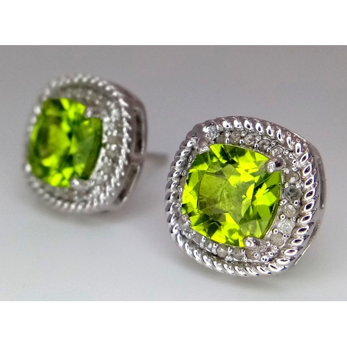 589 - A Pair of Peridot Gemstone Stud Earrings with Diamond Accents. Set in 925 Silver. Comes with a case.... 