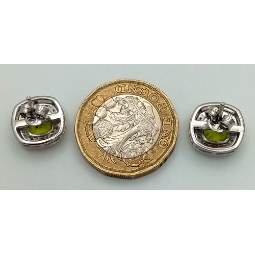 589 - A Pair of Peridot Gemstone Stud Earrings with Diamond Accents. Set in 925 Silver. Comes with a case.... 