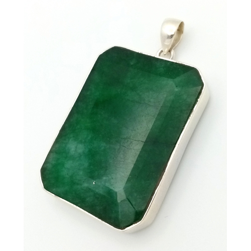 631 - A Large Rectangular Cut Emerald Gemstone Pendant. Set in 925 silver. 6cm. 29.5g total weight. CD-193... 