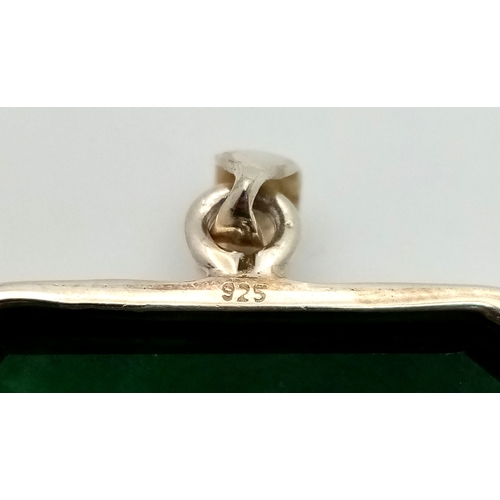 631 - A Large Rectangular Cut Emerald Gemstone Pendant. Set in 925 silver. 6cm. 29.5g total weight. CD-193... 