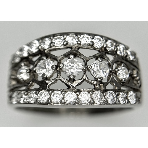 738 - A stunning 14K white gold CZ stone set ring. Total weight 3.7G. Size Q/R.
